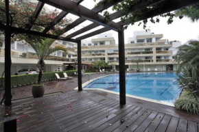 Apto moderno de 2 quartos com garagem próximo a Praia - Jurerê